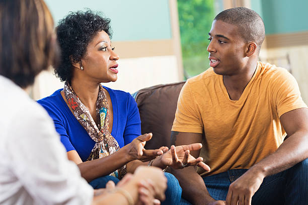 Woman discussing something during support meeting or Bible study Woman discussing something during support meeting or Bible study