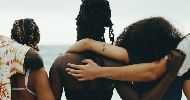 Shot of a group of friends embracing Shot of a group of friends embracing